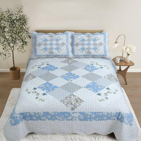 Virah Bella Blue Blossoms Quilt Set on bed
