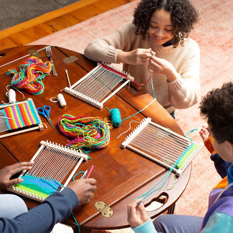 Children using Friendly Loom peg looms