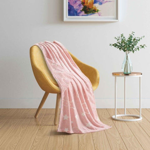 Hearts & Stars glow-in-the-dark hooded throw on chair