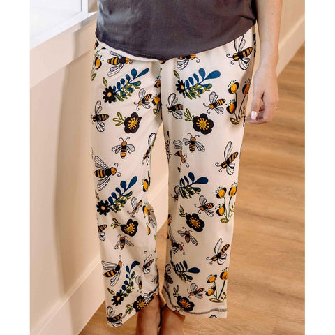 Woman wearing Lazy One Queen Bee women's pajama pants
