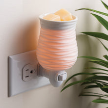 Plug-in wax warmer.