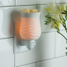 Pluggable Wax warmer.