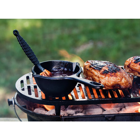 Lodge Cast Iron Melting Pot in use on grill