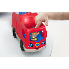Fire Truck with Lights On and Person Driving