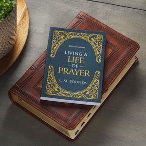 Living a Life of Prayer Mini Devotional on top of Bible