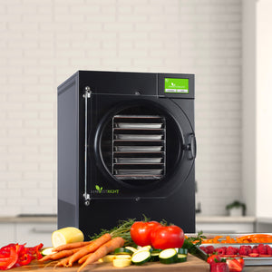 Harvest Right Home Pro Medium Freeze Dryer in black, showing it with vegetables on a counter