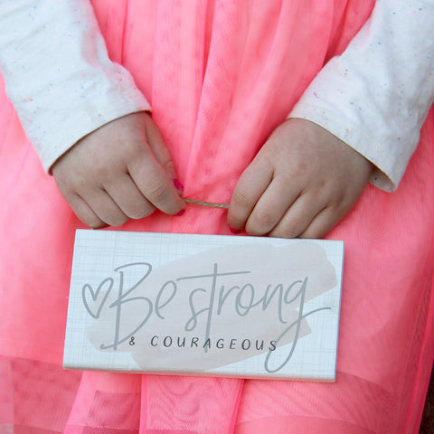 Little Girl Holding Sign