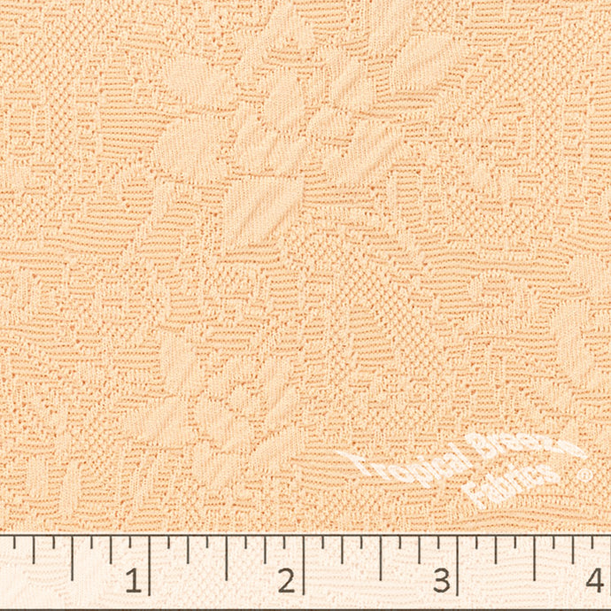 Peach colored Knit fabric with floral emboss