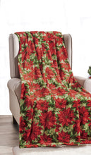 Poinsettia Christmas throw blanket covering a chair