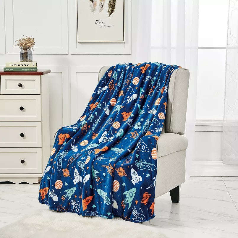 Space Adventure Throw Blanket on a chair