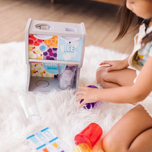 Girl playing with Thirst Quencher Dispenser and ice