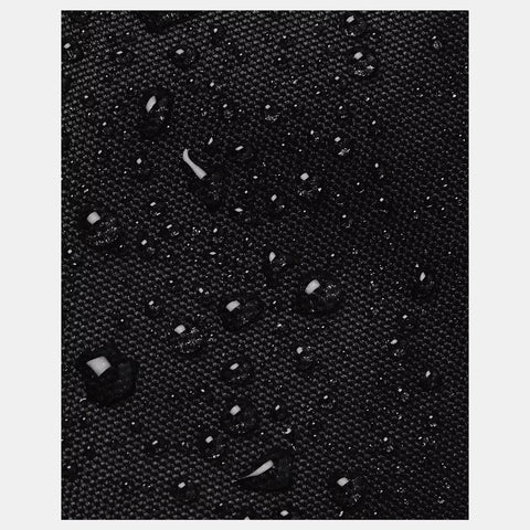 Black material repelling water droplets