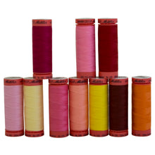 Mettler Thread in Assorted warm color shades.