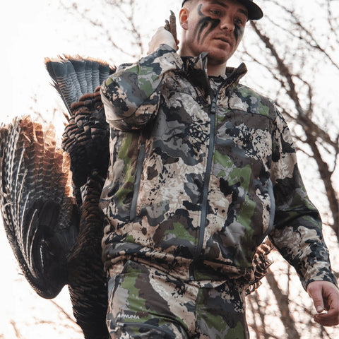 Hunter wearing Pnuma men's Alpha Vertex Jacket in caza