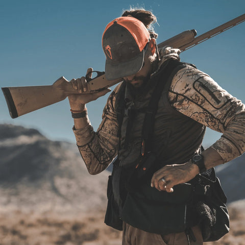 Hunter wearing a Pnuma men's Alpha Vertex Vest in beluga