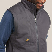 Closeup of Ariat men's Rebar Grey washed DuraCanvas insulated work vest showing zippered chest pocket