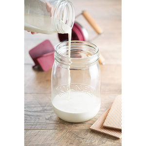 Pouring cream into churn 