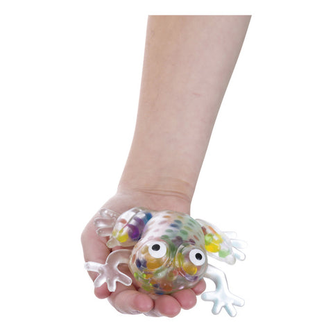 Child holding frog toy