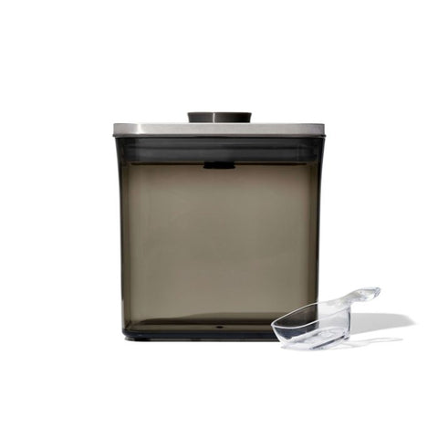 Container with scoop next to it