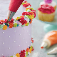 Adding flowers to cake