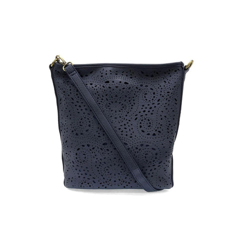 Joy Susan lazer cut eyelet bucket crossbody bag in denim