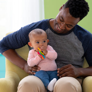 Baby holding toy keys