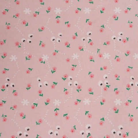 Floal print close up of doll crable