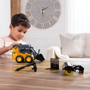 boy playing with skid loader