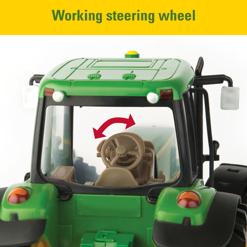 Toy tractor with a steering wheel that turns
