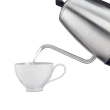 Electric tea kettle pouring water