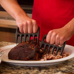 Person Shredding Meat with Meat Shredder Claws