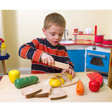 Boy playing with food set