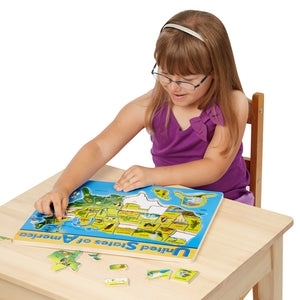 Girl putting puzzle together.