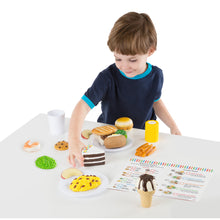 Boy playing with toy food