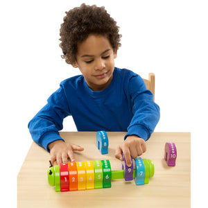Child using Counting Caterpillar toy