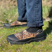 Men wearing a pair of Western Chief men's Ryderwood Realtree neoprene waterproof ankle boots