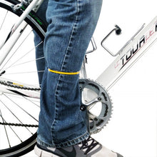 Bicyclist wearing metal leg bands