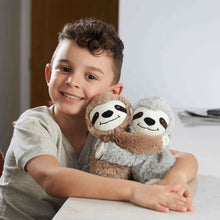 Boy holding stuffed toys