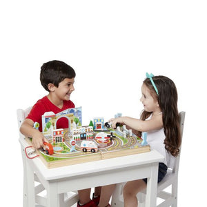 Boy and girl playing with set.
