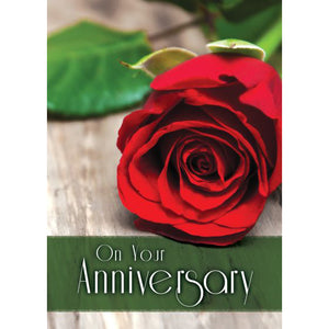 Front of Card 2: On Your Anniversary, red rose laying on table