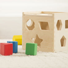 Shape sorting cube. 