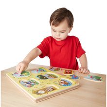 boy with nursery rhyme sound puzzle