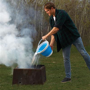 man pouring water on fire with Collapsible Bucket 2081