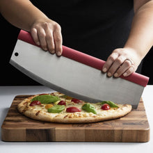 Person Cutting Pizza