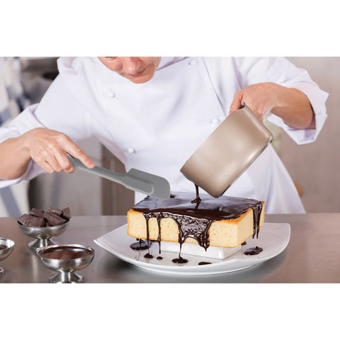Gray Silicone Slim Spatula being used to ice cake