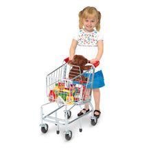 child with play shopping buggy