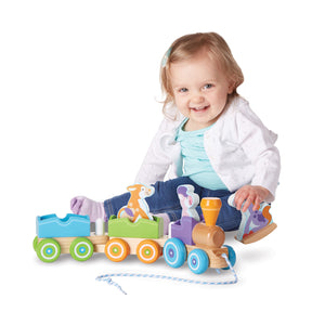 toddler with first play train set