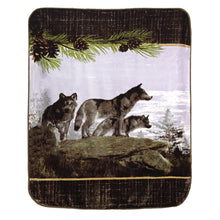 actual blanket-three wolves looking over the edge of a rock outcropping