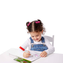 girl using magic pen and colorblast tablet
