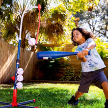 child swinging at ball hanging from tee